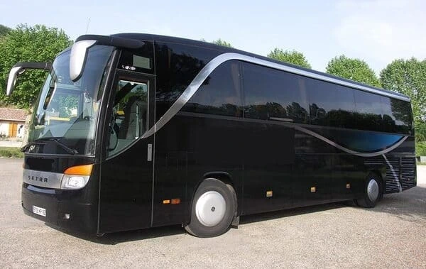 44 seater bus to hire in Paris Sleek 44-seater luxury coach available for hire in Paris, featuring a black exterior. Bus rental in Paris.