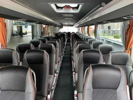 57 seater Grand Tourisme coach A Grand Tourisme coach is very comfortable, it's fully equipped and has a larger space between each row of seats