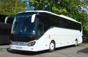 White 49-seater Setra coach parked in Paris