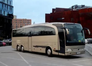 Champagne-colored 57-seater coach parked in Paris